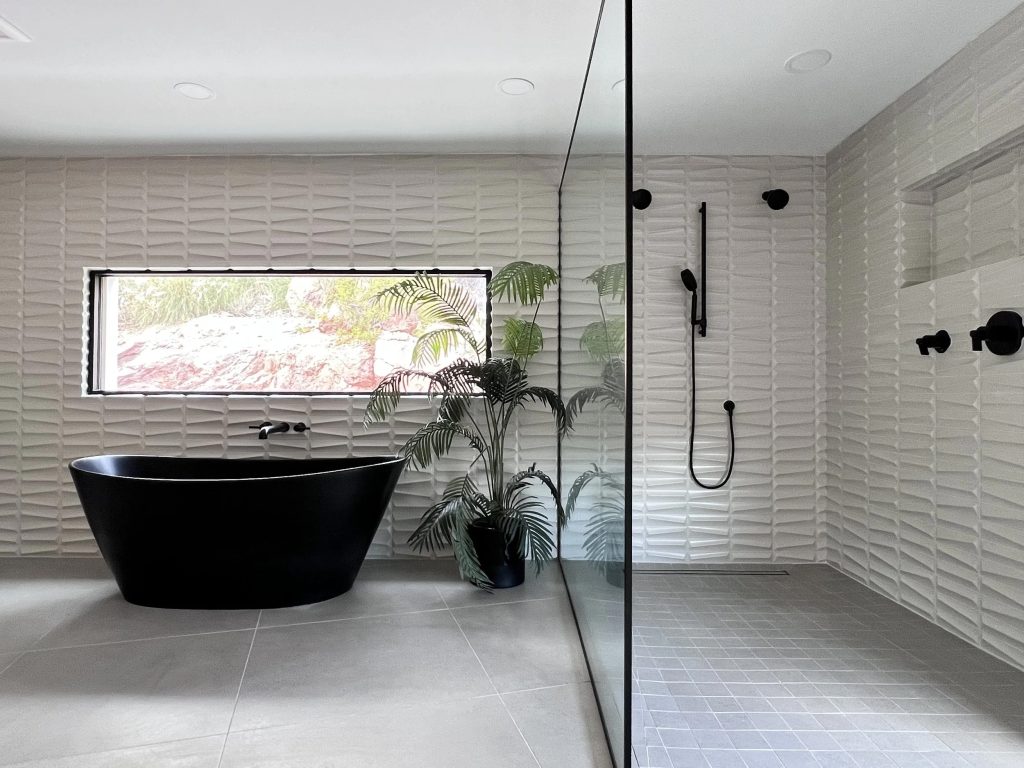 Open-concept shower with curbless entry and floor-to-ceiling glass